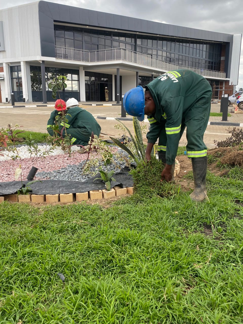 Newly landscaped commercial perimeter with stone hardscaping